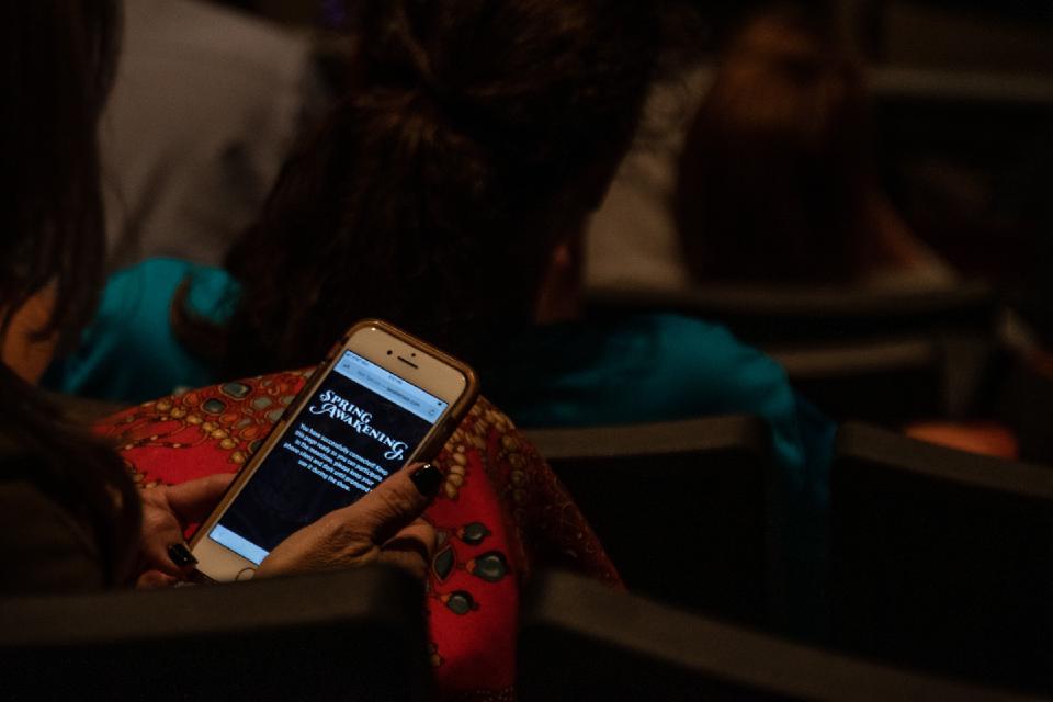 Participant with phone in her lap